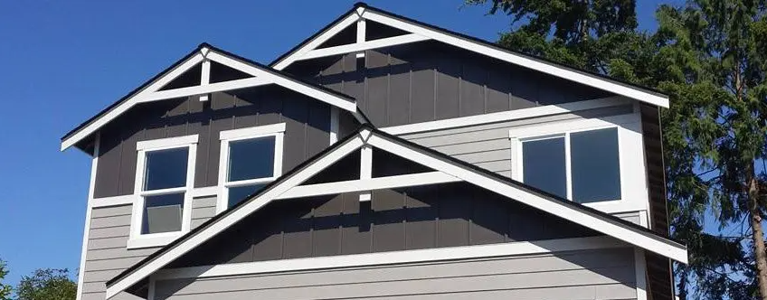Tan and Brown house with white trim